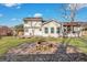 Spacious backyard featuring a fire pit, deck, lush lawn and private setting at 1652 Lauda Dr, Mount Pleasant, SC 29464