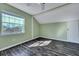 Sun-filled bedroom featuring a light wood floor, green walls and a large window at 1652 Lauda Dr, Mount Pleasant, SC 29464