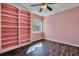 Comfortable bedroom featuring a decorative built-in bookshelf and hardwood floors at 1652 Lauda Dr, Mount Pleasant, SC 29464