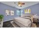 Comfortable bedroom with wood-look flooring, ceiling fan, and natural light at 1652 Lauda Dr, Mount Pleasant, SC 29464