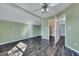 Cozy bedroom with sloped ceilings, dark wood floors and neutral green walls at 1652 Lauda Dr, Mount Pleasant, SC 29464