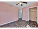 Bedroom features dark wood floors, light pink walls, and a closet at 1652 Lauda Dr, Mount Pleasant, SC 29464