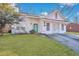 Well-kept home with green lawn and inviting entry featuring a bright blue front door at 1652 Lauda Dr, Mount Pleasant, SC 29464