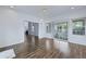 Living room with wood-look floors, ample windows and access to the sunroom at 1652 Lauda Dr, Mount Pleasant, SC 29464