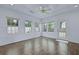 Bright sunroom with wood-look floors, ceiling fan and many windows to enjoy outdoor view at 1652 Lauda Dr, Mount Pleasant, SC 29464