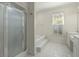 Well-lit bathroom featuring a glass-enclosed shower, garden tub, and double vanity at 1694 Jedburg Rd, Summerville, SC 29486