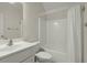 Bright bathroom featuring a shower and tub with a white shower curtain and single sink vanity at 1694 Jedburg Rd, Summerville, SC 29486