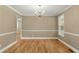 Dining room featuring hardwood floors, natural light, and an elegant chandelier at 1694 Jedburg Rd, Summerville, SC 29486