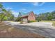Brick home with a green metal roof, a driveway, and a two-car garage at 1694 Jedburg Rd, Summerville, SC 29486