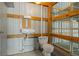 Utility bathroom inside garage area, featuring a sink and toilet, providing convenience for projects at 1694 Jedburg Rd, Summerville, SC 29486