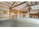 Bright and spacious garage interior with ample storage and workshop area, featuring exposed beams at 1694 Jedburg Rd, Summerville, SC 29486