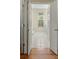 Bright hallway featuring tile flooring leading to a bathroom with natural light at 1694 Jedburg Rd, Summerville, SC 29486