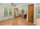 Bright eat-in kitchen featuring wood cabinets, modern appliances, and a spacious breakfast nook with hardwood floors at 1694 Jedburg Rd, Summerville, SC 29486