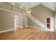 Bright living room with staircase, hardwood floors, and natural light at 1694 Jedburg Rd, Summerville, SC 29486
