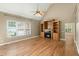 Cozy living room featuring a fireplace with built-in shelving and hardwood floors at 1694 Jedburg Rd, Summerville, SC 29486