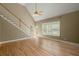 Spacious living room with vaulted ceiling, hardwood floors, and staircase access at 1694 Jedburg Rd, Summerville, SC 29486
