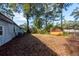 Large backyard with mature trees, shed, and plenty of space for outdoor activities at 20 Stratton Dr, Charleston, SC 29420