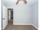 Spacious bedroom features new floors, fresh paint, ceiling fan and a doorway to an additional space at 20 Stratton Dr, Charleston, SC 29420