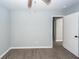 Bedroom featuring ceiling fan, new floor, and access to additional rooms at 20 Stratton Dr, Charleston, SC 29420