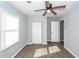 Bedroom with wood-look floors, ceiling fan, window, and closet at 20 Stratton Dr, Charleston, SC 29420
