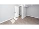 Bedroom with open door features neutral paint, new flooring, and access to another room at 20 Stratton Dr, Charleston, SC 29420