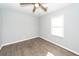 This bedroom features a ceiling fan and a window for natural light at 20 Stratton Dr, Charleston, SC 29420