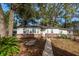 Charming single-story home featuring a brick foundation and a well-manicured front yard at 20 Stratton Dr, Charleston, SC 29420