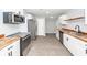 Modern kitchen featuring stainless steel appliances, white cabinets, and butcher block counters at 20 Stratton Dr, Charleston, SC 29420