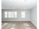 Bright living room featuring large windows, modern floors, and neutral paint at 20 Stratton Dr, Charleston, SC 29420