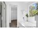 Bright bathroom showcasing a modern bathtub, sleek fixtures, and a refreshing view from the window at 229 Night Heron St # 602, Summerville, SC 29486