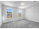 Well-lit bedroom offering a cozy atmosphere with soft carpeting and lovely outdoor views from the windows at 229 Night Heron St # 602, Summerville, SC 29486