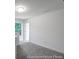 Upstairs bonus room with carpet floors and natural light; adaptable space for office or Gathering area at 229 Night Heron St # 602, Summerville, SC 29486