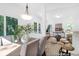 Open-concept dining area with views into the living room and kitchen, featuring modern decor and plenty of natural light at 229 Night Heron St # 602, Summerville, SC 29486