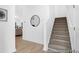 Foyer showing staircase and hallway leads to a bright and inviting space, finished with modern flooring at 229 Night Heron St # 602, Summerville, SC 29486