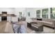 Bright living room view showcasing an open floor plan with kitchen and dining room and neutral interior at 229 Night Heron St # 602, Summerville, SC 29486