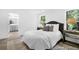 Well-lit primary bedroom offers an attached bathroom, large windows, and a comfortable atmosphere for rest at 229 Night Heron St # 602, Summerville, SC 29486