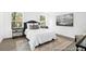 Spacious primary bedroom features lots of natural light, a plush bed, and stylish décor, with carpeted floors at 229 Night Heron St # 602, Summerville, SC 29486