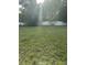 A spacious, sun-drenched backyard with lush green grass and a pristine white fence offering privacy at 233 N Pandora Dr, Goose Creek, SC 29445