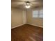 Bedroom featuring hardwood floors, neutral walls, a ceiling fan, window and a closet door at 233 N Pandora Dr, Goose Creek, SC 29445