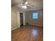 A bedroom features vinyl floors, neutral walls, a ceiling fan, window and a closet with bi-fold doors at 233 N Pandora Dr, Goose Creek, SC 29445