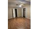 Spacious bedroom with ceiling fan, wood-look floors and closet at 233 N Pandora Dr, Goose Creek, SC 29445