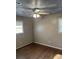 Bedroom with ceiling fan, two windows and hardwood floors at 233 N Pandora Dr, Goose Creek, SC 29445