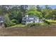 Backyard view of a lovely two story home with trees and greenery all around the property at 2345 Waring Hall Ln, Charleston, SC 29414