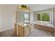Bathroom with light wooden vanity, big mirror, and soaking tub with a view of the marsh and trees at 2345 Waring Hall Ln, Charleston, SC 29414