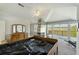 Large bedroom with fireplace, vaulted ceiling, and balcony access offering beautiful scenic views at 2345 Waring Hall Ln, Charleston, SC 29414