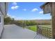 A spacious deck offers beautiful views of the marsh, trees, blue sky, and backyard area at 2345 Waring Hall Ln, Charleston, SC 29414