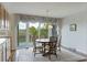 Bright dining room with a chandelier and large windows offering scenic outdoor views at 2345 Waring Hall Ln, Charleston, SC 29414