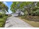 Charming home features a two-car garage, mature trees, and meticulously maintained landscaping at 2345 Waring Hall Ln, Charleston, SC 29414