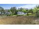 Rear view of a lovely home showing the backyard with a deck and steps to the green yard at 2345 Waring Hall Ln, Charleston, SC 29414