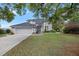 Charming two-story home with a landscaped yard, mature trees, and a welcoming front entrance at 2345 Waring Hall Ln, Charleston, SC 29414